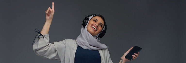 A Saudi woman Listening To Music