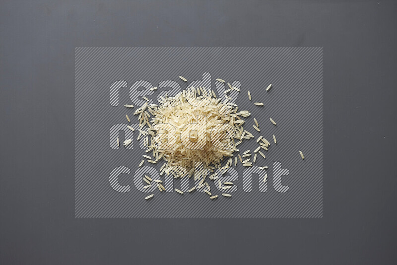 Basmati golden rice on grey background