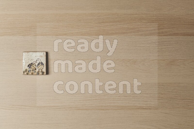 قواعد أكواب فخارية مزخرفة على خلفية خشبية فاتحة