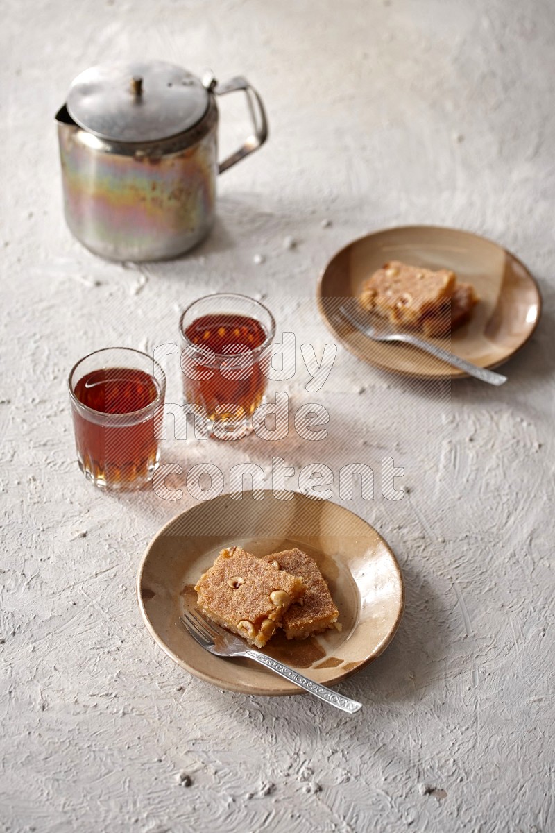 Basbousa with tea in a light setup