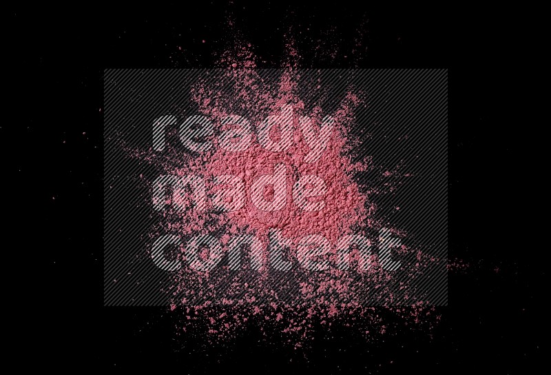 Red powder on black background