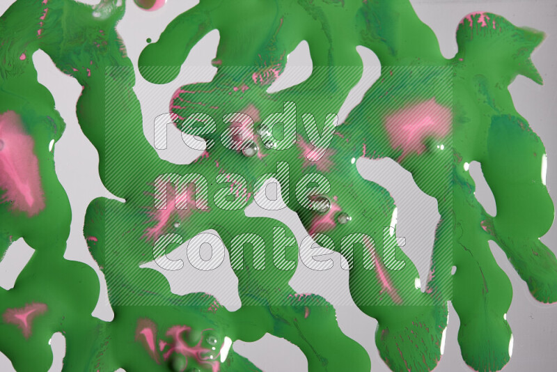 Abstract colorful background with mixed of pink and green paint colors