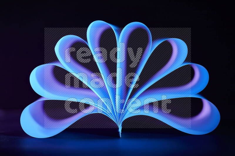 An abstract art piece displaying smooth curves in blue and purple gradients created by colored light