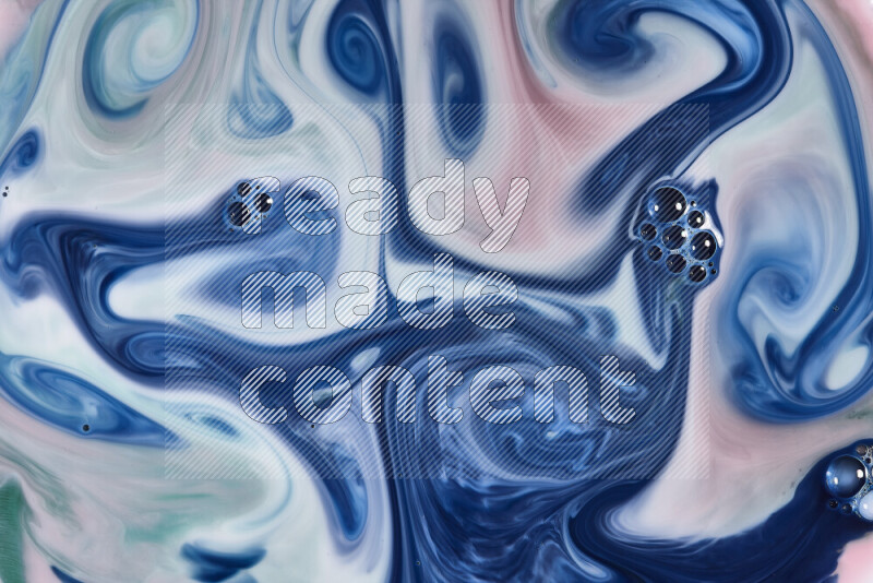 A close-up of abstract swirling patterns in red, green, white and blue