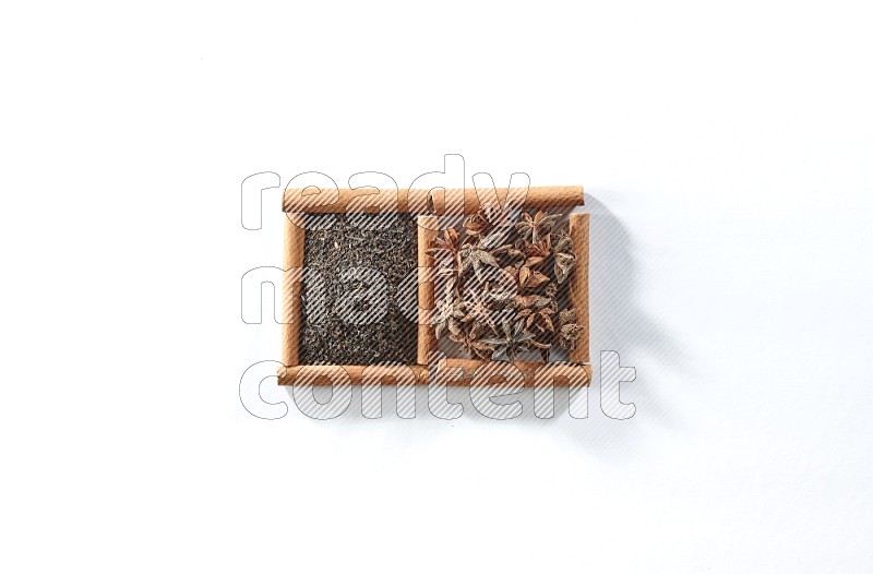 2 squares of cinnamon sticks full of black tea and star anise on white flooring