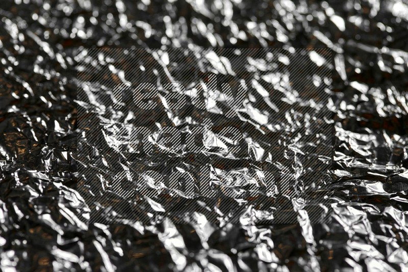 Aluminium foil on black background