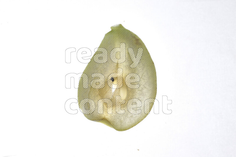 Pear slices on illuminated white background