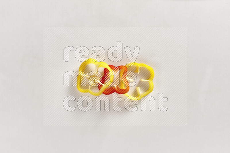 Assorted bell pepper slices on white background