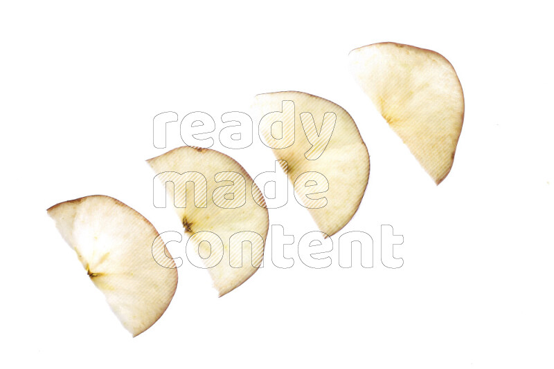 Apple slices on illuminated white background