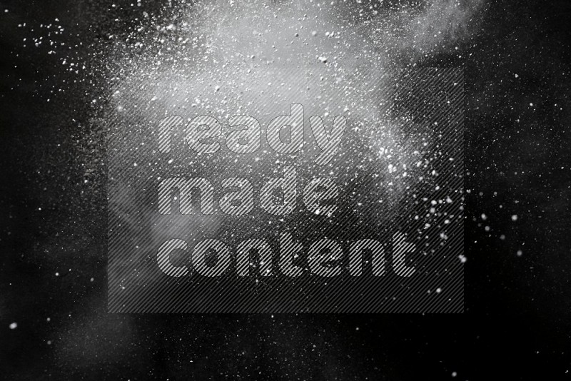 White powder explosion on black background