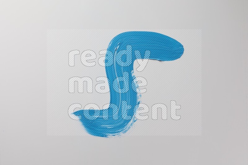 A single blue S curved brush stroke on a white background