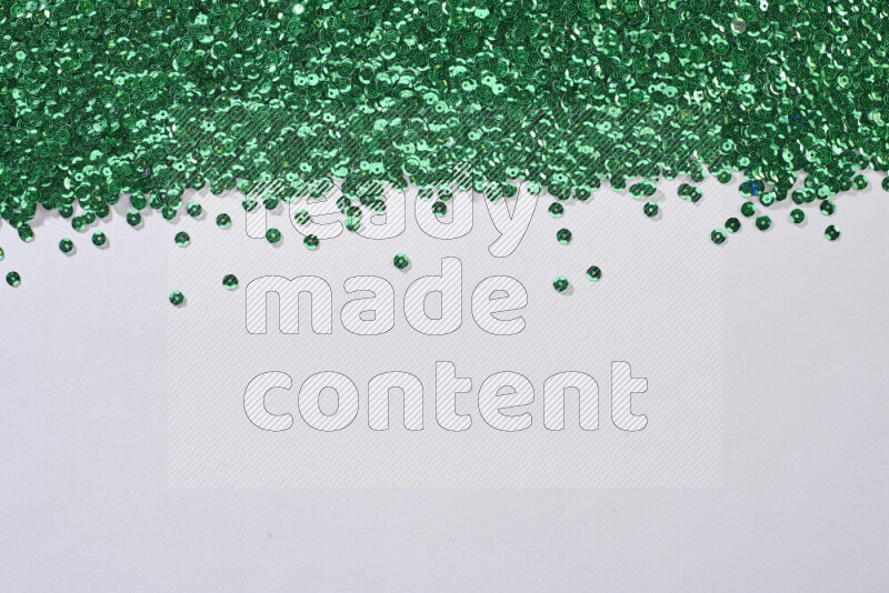 Multicolored flat sequins on grey background