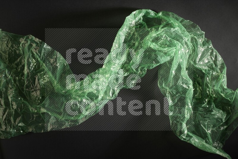 Colored plastic textures on black background