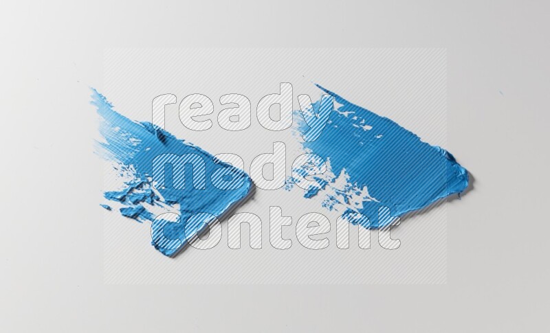Blue painting knife strokes on white background