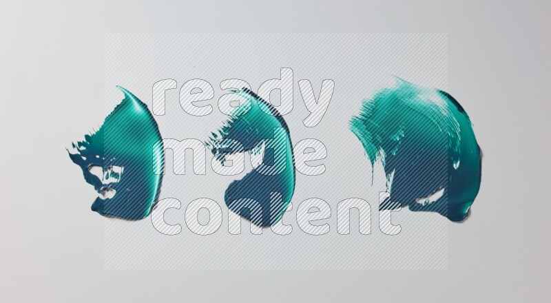 Turquoise painting knife strokes on white background