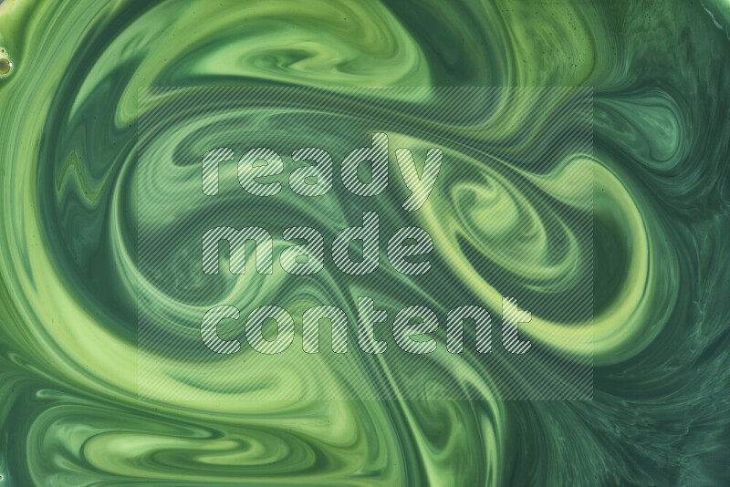 A close-up of abstract swirling patterns in green gradients