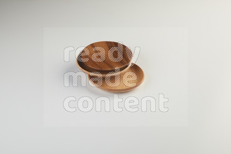 Wooden bowl and plate on white background