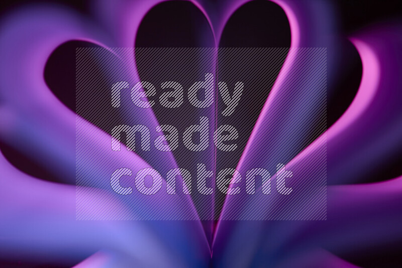 An abstract art piece displaying smooth curves in pink and purple gradients created by colored light