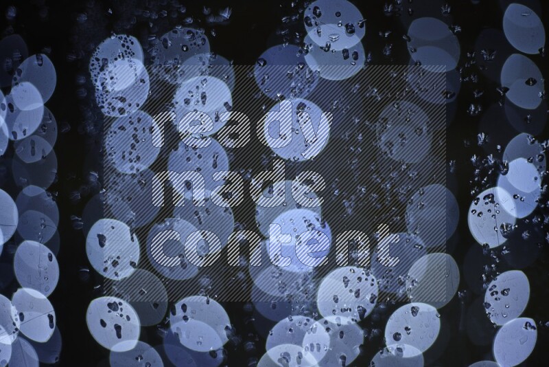 Bokeh light in white with water drops