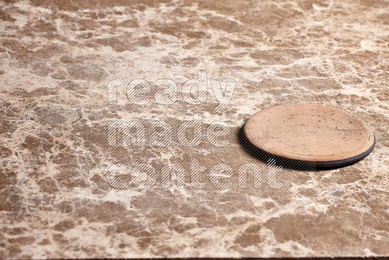 Flat Pottery Plate Coaster on Beige Marble Flooring, 45 degrees