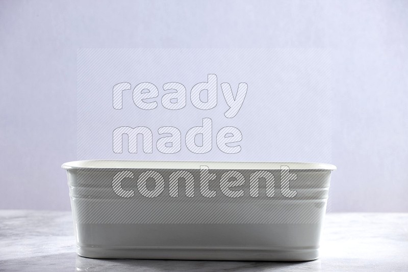 An Empty White Plant Pot on light grey Marble Flooring 15 degree angle