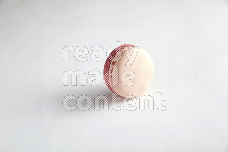 45º Shot of Pink Litchi Raspberry macaron on white background