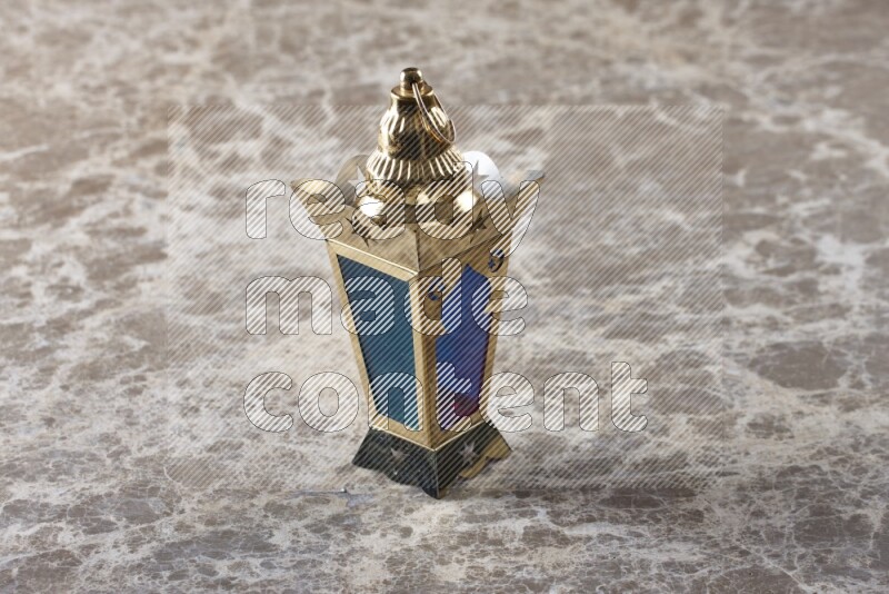 A lantern placed on a beige marble background