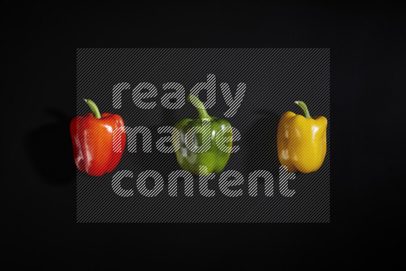 Assorted bell pepper on black background