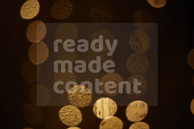 Bokeh light in yellow with water drops