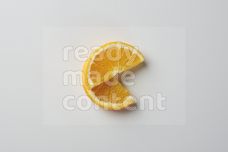 Two halves of an orange slices on white background
