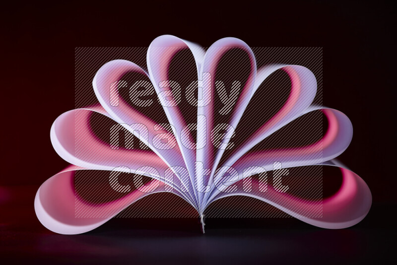 An abstract art piece displaying smooth curves in pink and purple gradients created by colored light
