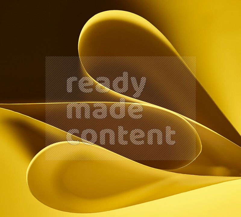 An abstract art of paper folded into smooth curves in yellow gradients
