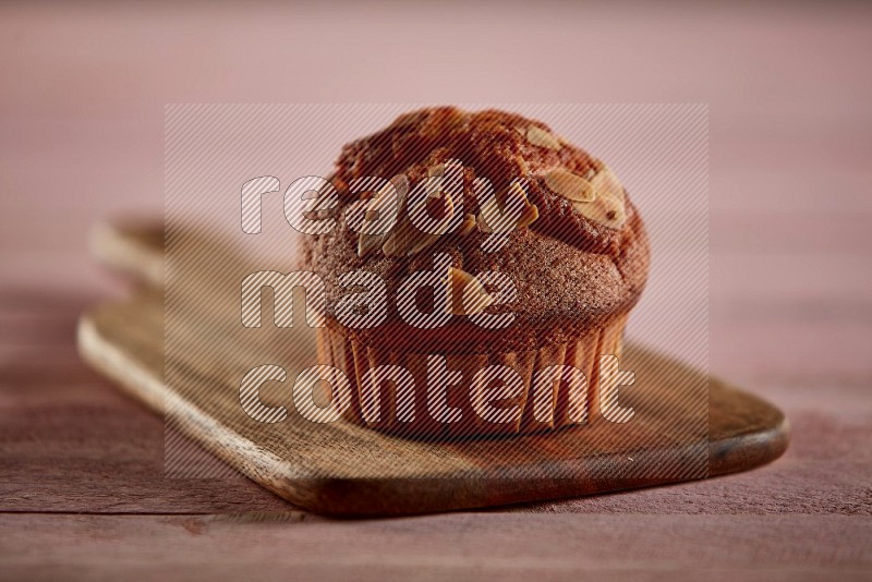 Almond cupcake on a wooden board