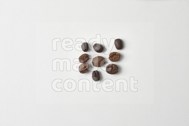 Roasted coffee beans on white background