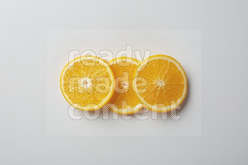 Three orange slices on a white background