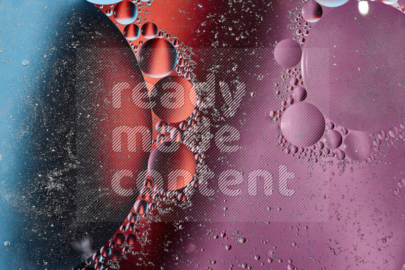 Close-ups of abstract oil bubbles on water surface in shades of blue, red and purple