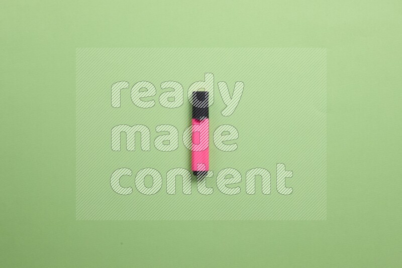Multicolored highlighter pens on green background