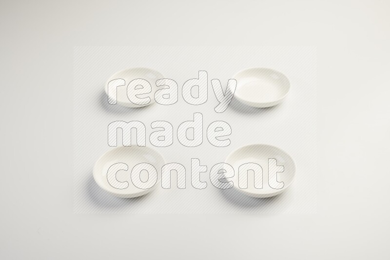 white ceramic round sauce dish on white countertop