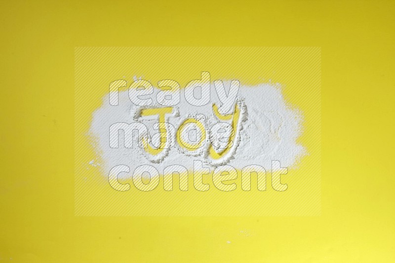A word written with powder on yellow background