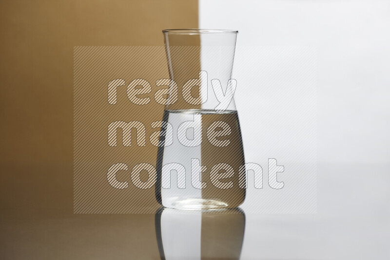 The image features a clear glassware filled with water, set against white and beige background