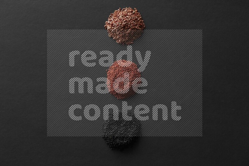 حبة البركة و حبوب الخردل وحبوب الكتان وحب الرشاد علي خلفية سوداء