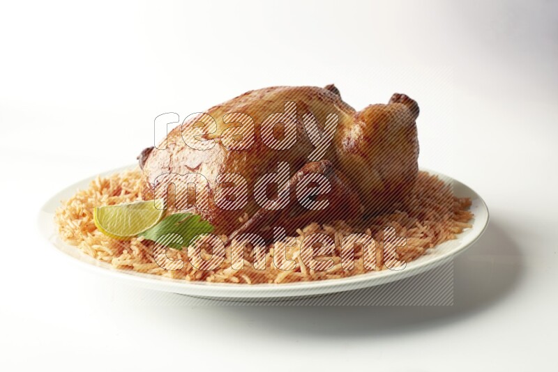red basmati Rice with  whole roasted chicken on a white rounded plate  direct  on white background