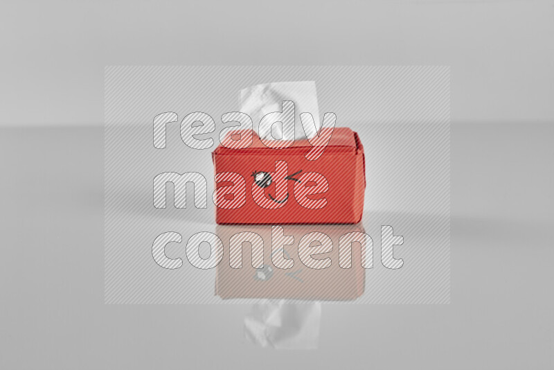 Origami tissue box on grey background