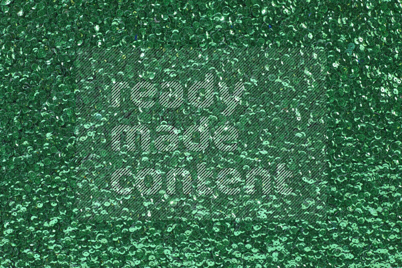 Multicolored flat sequins on grey background