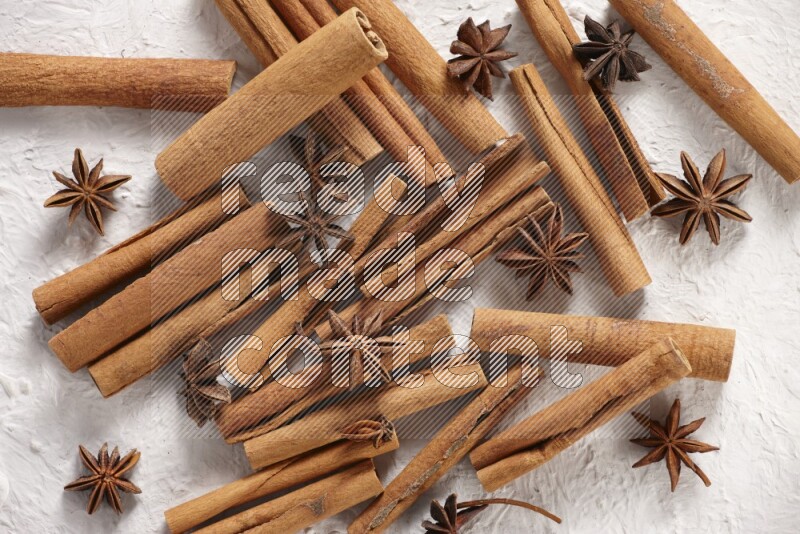 cinnamon sticks with star anise on white background