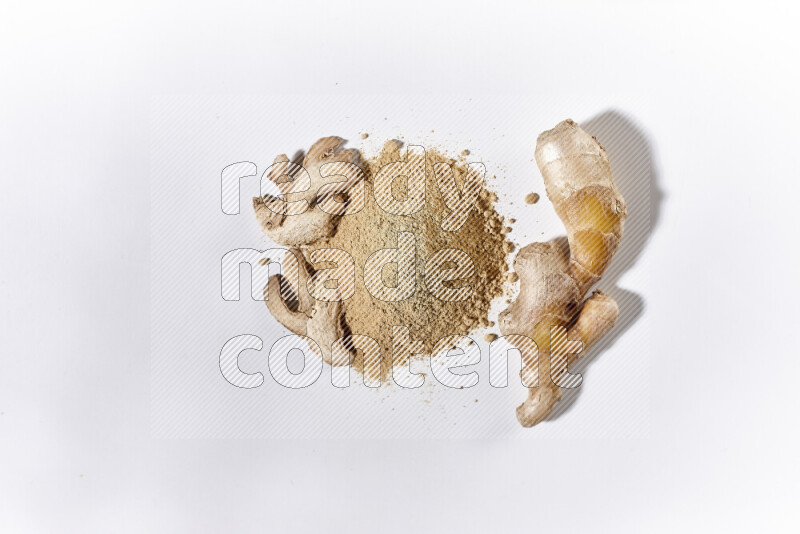 A bunch of ground ginger powder on white background