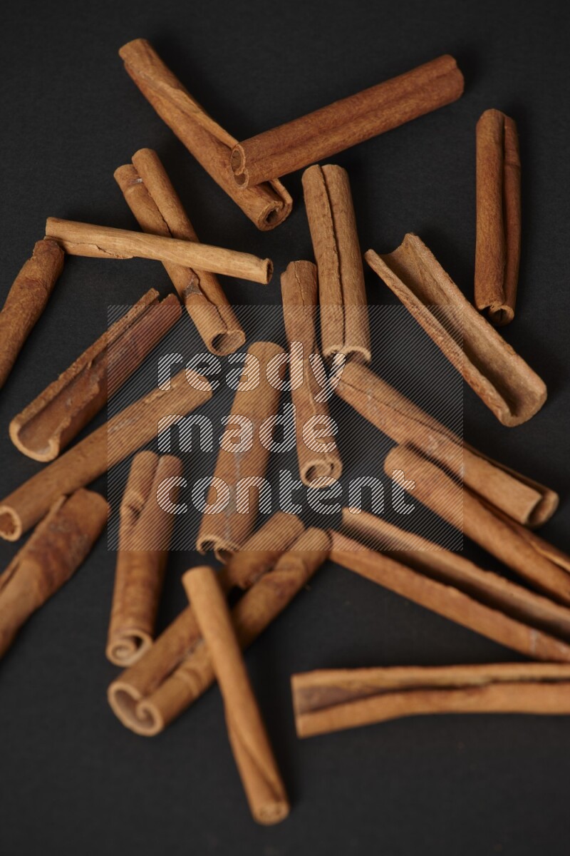 Cinnamon sticks on black background