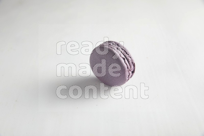 45º Shot of Purple Blueberry macaron on white background