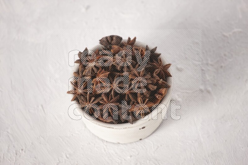 Star Anise in a white bowl on white background