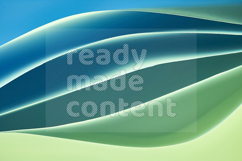 This image showcases an abstract paper art composition with paper curves in green and blue gradients created by colored light